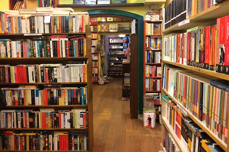 Library,Bookcase,Shelving,Public library,Shelf,Bookselling,Book,Publication,Building,Furniture