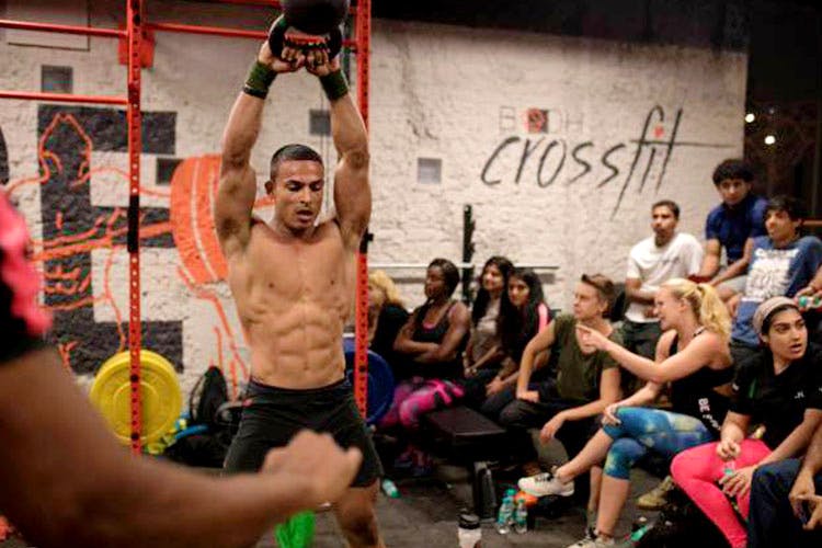 Physical fitness,Crossfit,Event,Room,Barechested,Muscle,Crowd,Exercise,Dance,Chest