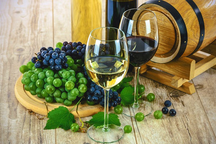 Grape,Wine glass,Stemware,Wine bottle,Drink,Wine,Bottle,Glass,Red wine,White wine