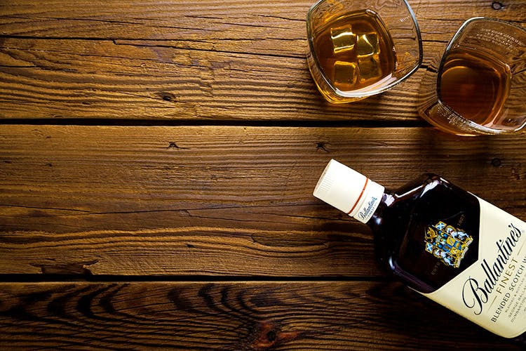 Liqueur,Drink,Wood,Wood stain,Alcohol,Distilled beverage,Bottle,Hardwood,Whisky,Glass bottle
