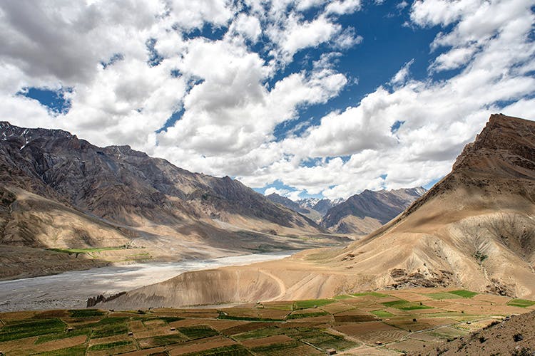 Mountainous landforms,Mountain,Highland,Sky,Nature,Mountain range,Mountain pass,Natural landscape,Valley,Cloud