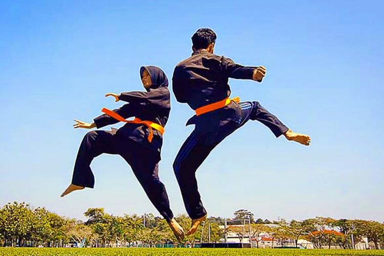 Kick,Kung fu,Sports,Jumping,Martial arts,Contact sport,Happy,Individual sports,Tricking,Strike