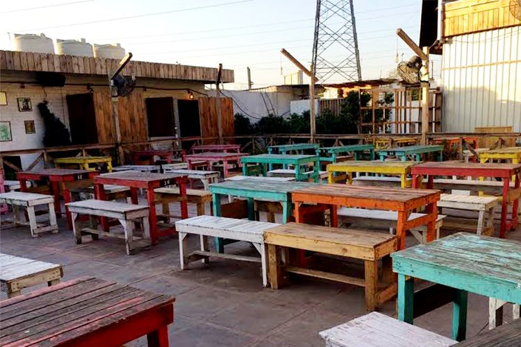 Furniture,Table,Building,Room,Restaurant,Patio,Wood,Outdoor furniture,Chair