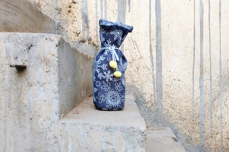 Yellow,Wall,Sculpture,Bottle,Art,Visual arts,Plant,Stone carving,Glass