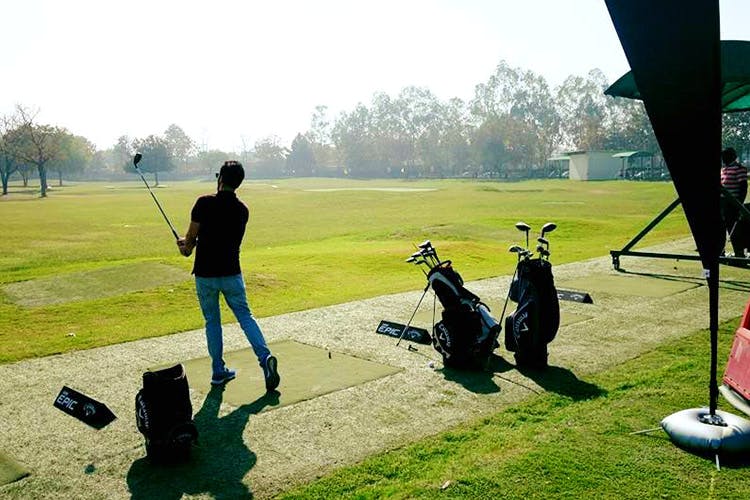 Golf,Golf club,Golf course,Golfer,Sport venue,Golf equipment,Professional golfer,Grass,Recreation,Lawn