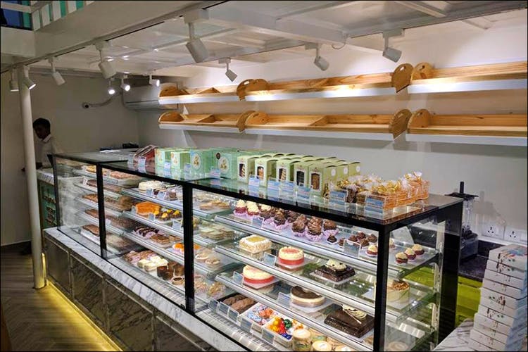 Bakery,Display case,Delicatessen,Pâtisserie,Building,Food,Grocery store,Business,Interior design,Pastry