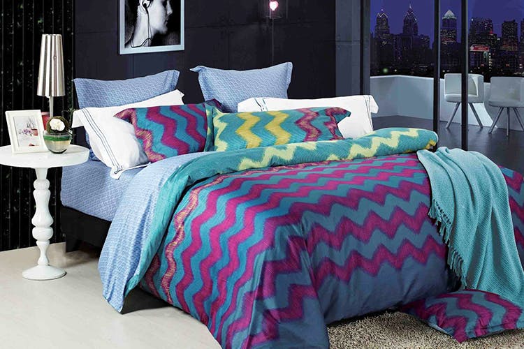 Bed sheet,Bedding,Bed,Furniture,Bedroom,Duvet cover,Blue,Textile,Purple,Room