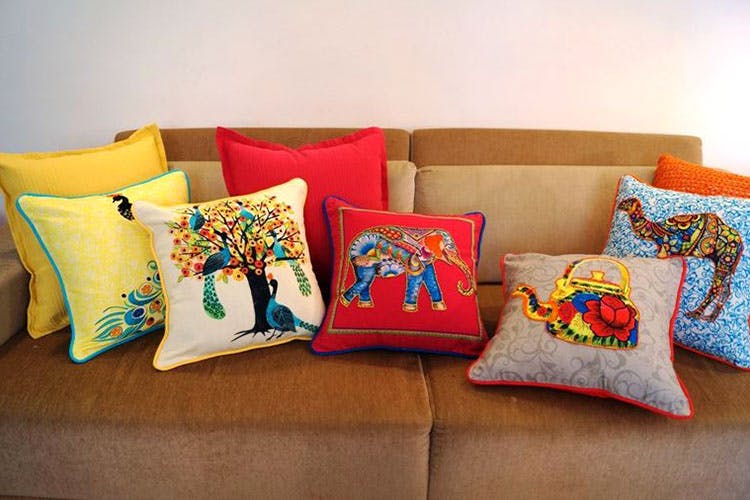 Multi coloured sofa store cushions