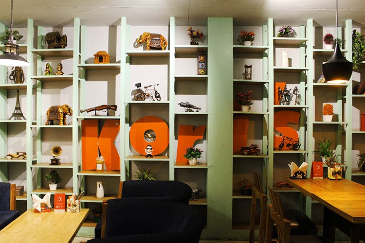 Shelf,Shelving,Orange,Room,Furniture,Building,Bookcase,Interior design,Design,Architecture