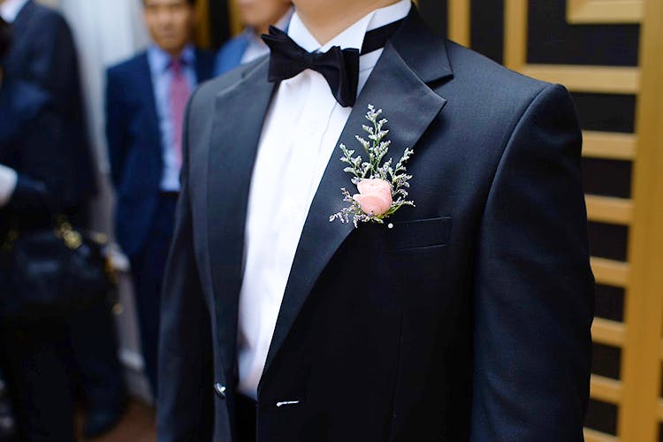 Suit,Formal wear,Tuxedo,Gentleman,Tie,Male,Groom,Event,Bow tie,Fashion accessory