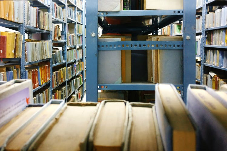 Library,Public library,Bookselling,Book,Building,Shelving,Shelf,Inventory,Publication,Bookcase