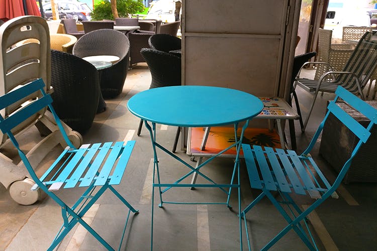 Chair,Blue,Furniture,Table,Turquoise,Outdoor table,Folding chair,Restaurant,Outdoor furniture,Room