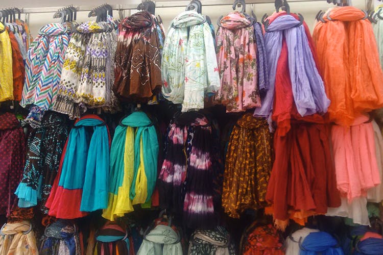 Clothing,Selling,Bazaar,Boutique,Public space,Textile,Market,Marketplace,Scarf,Outerwear