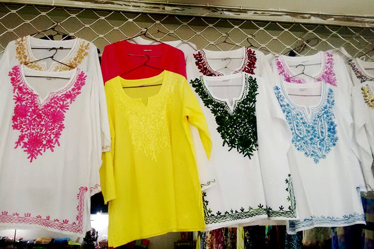 Clothing,Yellow,T-shirt,Pink,Dress,Fashion,Boutique,Outerwear,Textile,Clothes hanger