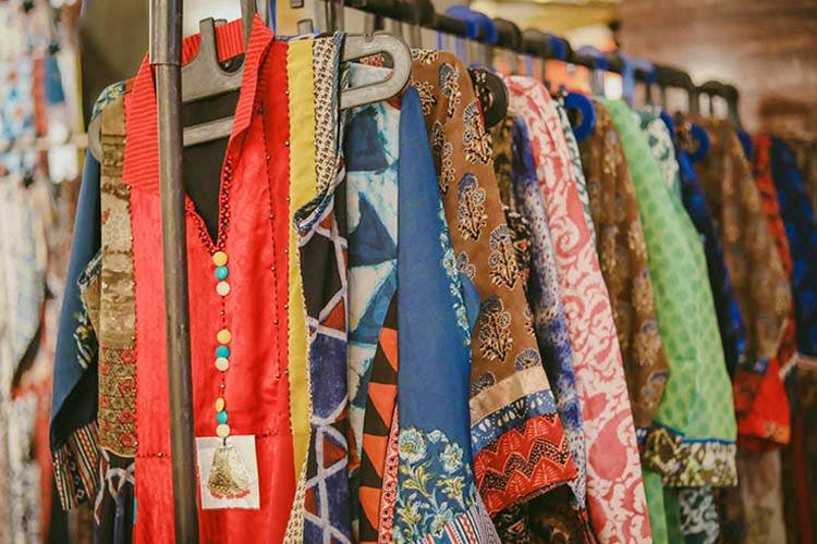Textile,Boutique,Room,Linens,Art,Quilt,Bazaar,Visual arts,Woven fabric
