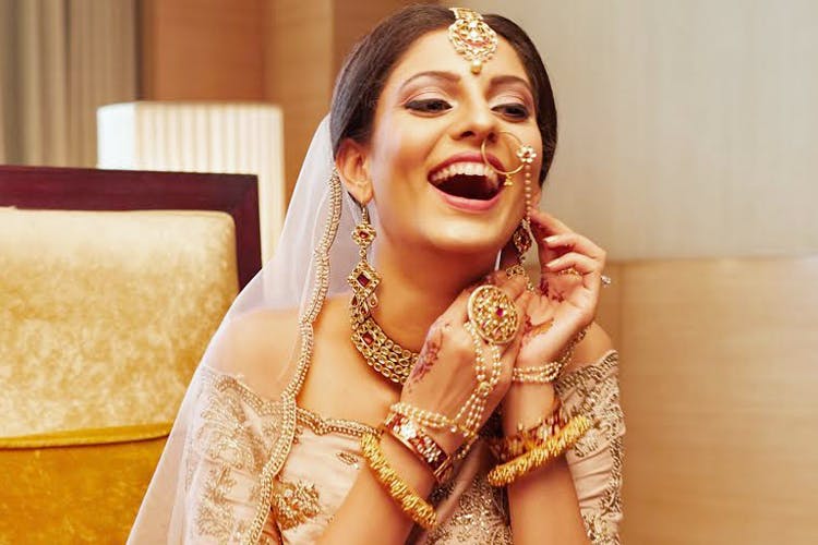 Facial expression,Skin,Yellow,Smile,Tradition,Bride,Happy,Fun,Laugh,Jewellery