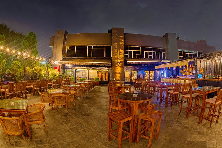 Restaurant,Night,Sky,Building,Resort,Architecture,Mixed-use,Bar,Photography,Table