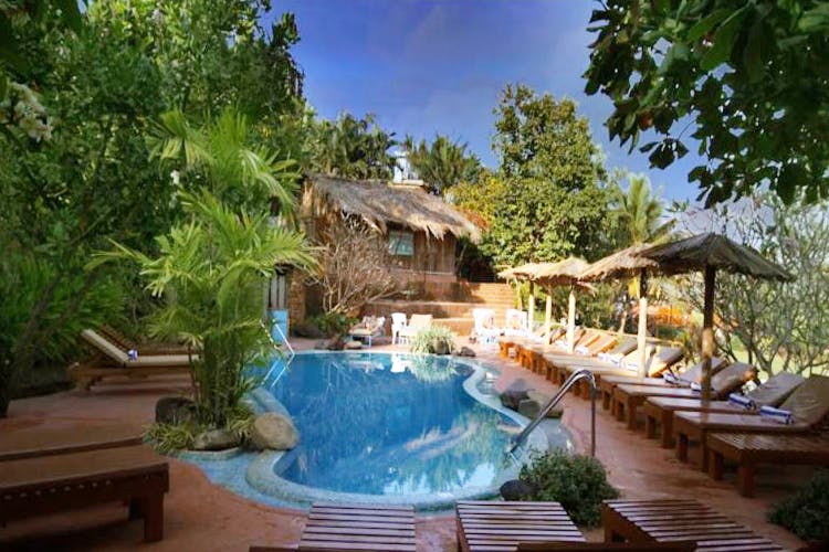 Swimming pool,Resort,Property,Natural landscape,Eco hotel,Real estate,Backyard,Leisure,Building,Estate