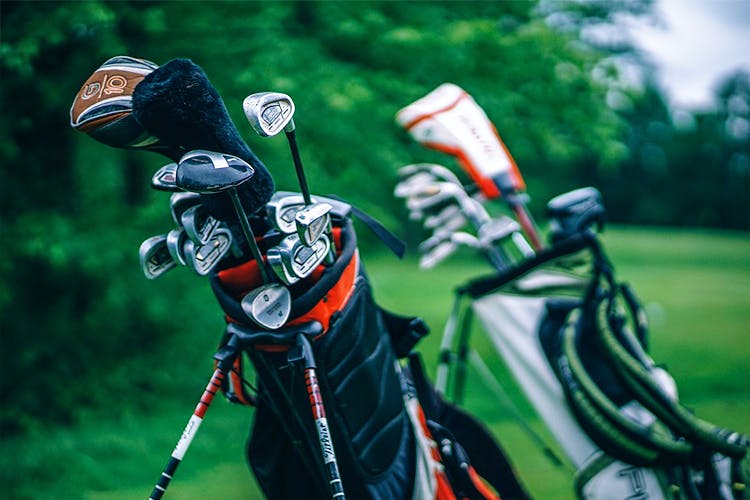 Golf equipment,Golf club,Golf,Games,Iron,Recreation,Sports equipment,Grass,Precision sports,Putter