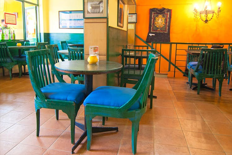 Room,Table,Furniture,Turquoise,Chair,Dining room,Floor,Building,Interior design,Restaurant