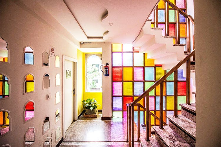 Interior design,Yellow,Building,Room,House,Window,Architecture,Glass,Ceiling,Stairs