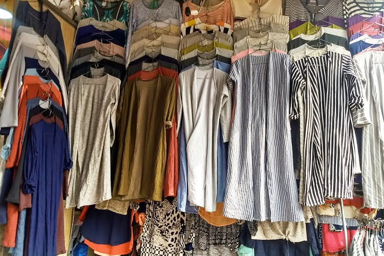 Clothing,Boutique,Clothes hanger,Room,Textile,Bazaar,Dress,Closet,Outerwear,Vintage clothing