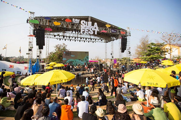 Crowd,People,Yellow,Public space,Public event,Event,Festival,Fair,Stage,Bazaar