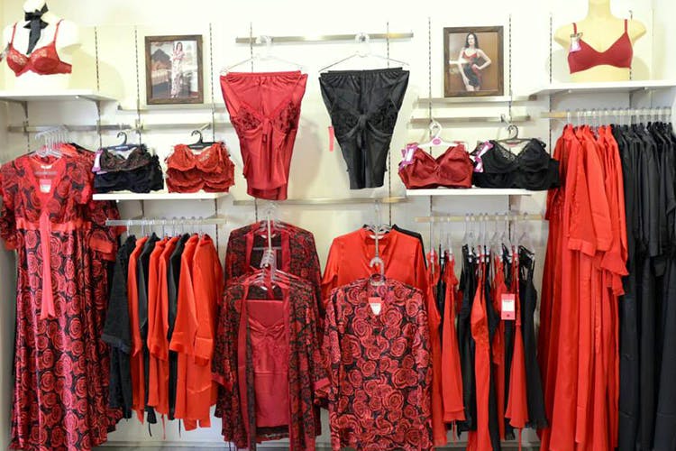 Red,Boutique,Clothing,Room,Fashion,Dress,Textile,Closet,Clothes hanger,Fashion design