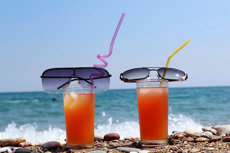 Drink,Juice,Summer,Non-alcoholic beverage,Eyewear,Vacation,Sea breeze,Paradise,Cocktail,Sunglasses