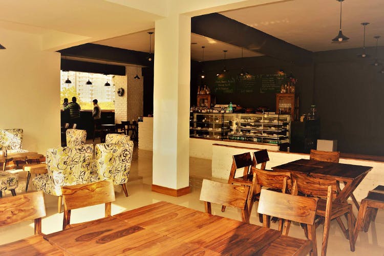 Room,Building,Interior design,Property,Furniture,Floor,Wood flooring,Hardwood,Ceiling,Table