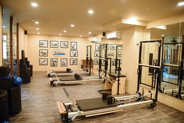 Gym,Physical fitness,Room,Building,Sport venue,Exercise,Exercise equipment,Interior design,Exercise machine,Pilates