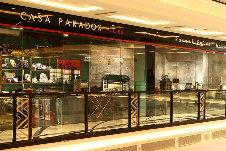 Building,Retail,Display case,Shopping mall,Display window,Outlet store,Glass,Interior design