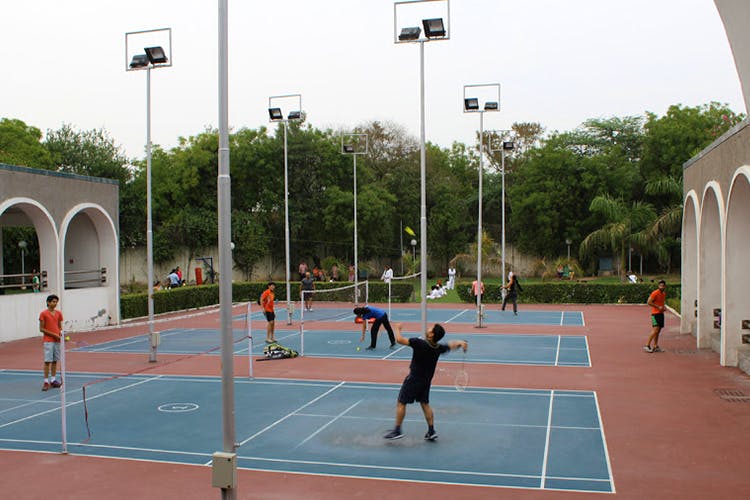Sport venue,Sports,Ball game,Tennis player,Tennis court,Racquet sport,Leisure,Basketball court,Athletic shoe,Tennis