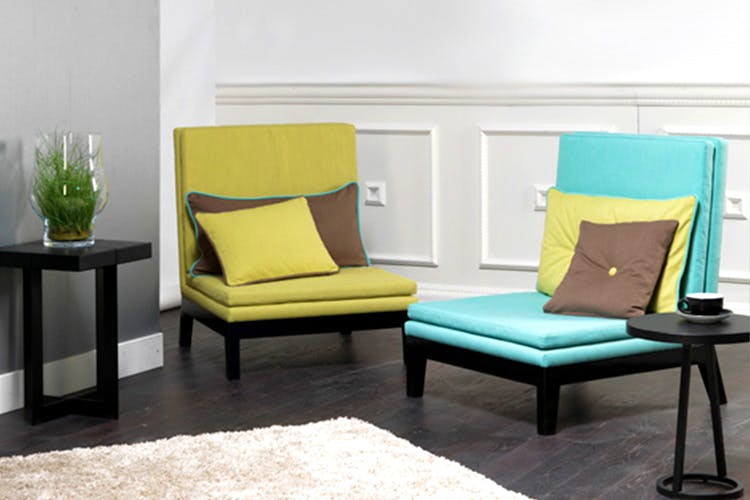 Furniture,Room,Living room,Chair,Turquoise,Yellow,Interior design,Couch,Table,Coffee table