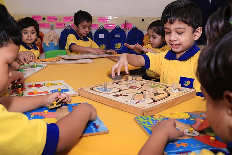 Learning,Games,Indoor games and sports,Sharing,Play,Education,School,Recreation,Kindergarten,Leisure