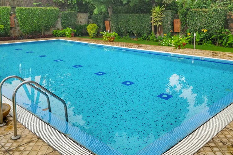 Swimming pool,Property,Leisure,Grass,Rectangle,Real estate,Recreation,Swimming machine,Leisure centre,House