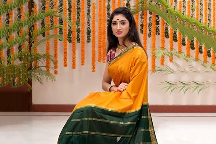 Clothing,Sari,Orange,Textile,Formal wear,Photo shoot,Sitting,Silk