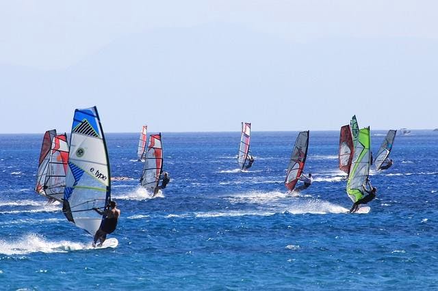 Windsurfing,Water sport,Surface water sports,Boardsport,Surfing Equipment,Outdoor recreation,Recreation,Wind,Sail,Wind wave