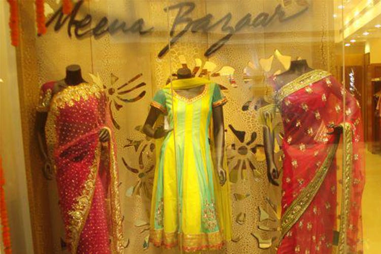 Boutique,Clothing,Yellow,Dress,Formal wear,Textile,Display window,Fashion design,Room,Collection