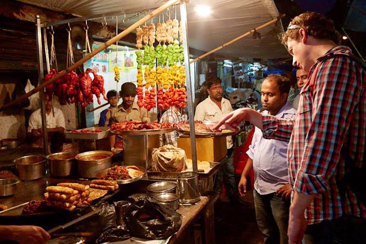 Selling,Market,Street food,Marketplace,Public space,Bazaar,Food,Cuisine,Shopkeeper,Stall