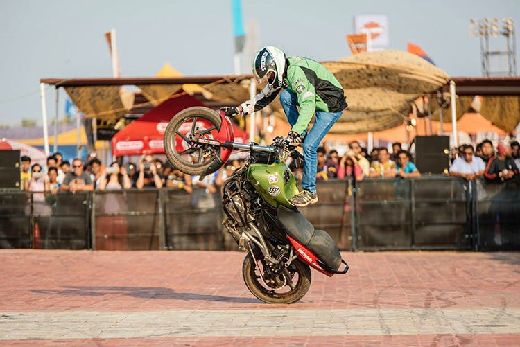 Stunt,Stunt performer,Wheelie,Motorcycle,Extreme sport,Vehicle,Motorcycling,Sports,Motocross,Freestyle motocross