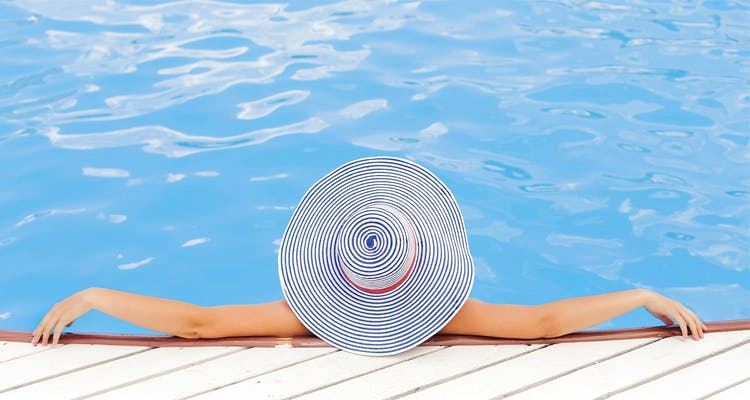 Swimming pool,Leisure,Vacation,Fun,Summer,Headgear,Recreation,Cap
