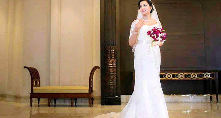 Gown,Wedding dress,Bride,Dress,Bridal clothing,Clothing,Photograph,Shoulder,Bridal accessory,Bridal party dress