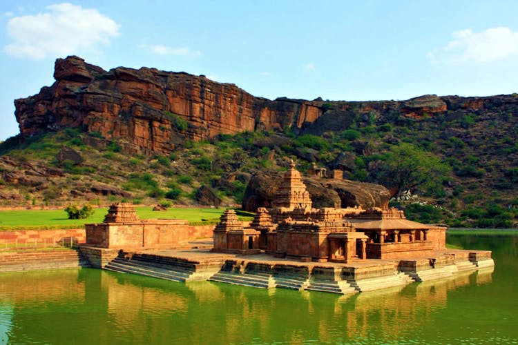 Natural landscape,Historic site,Landmark,Reflection,Tourism,Sky,Landscape,Building,River,Ancient history