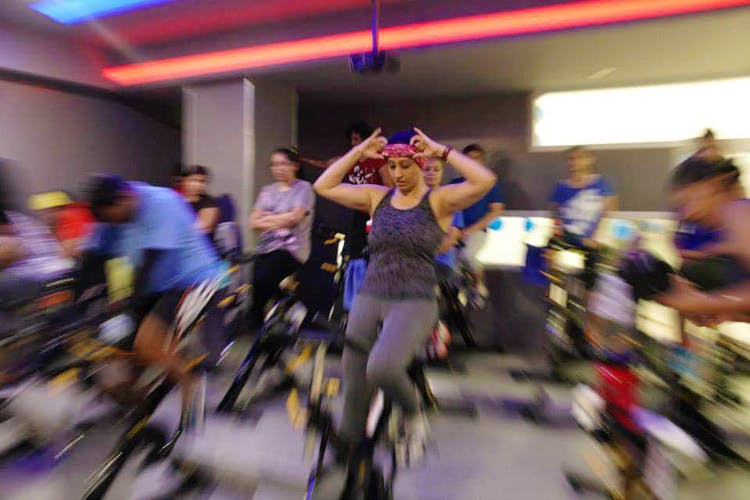 Indoor cycling,Event,Crowd,Footwear,Dance,Room,Exercise,Leisure,Performance,Sports