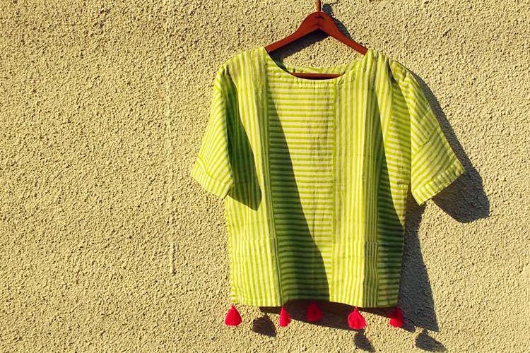 Clothing,Green,Yellow,Clothes hanger,Sleeve,Outerwear,T-shirt,Dress,Textile,Pattern
