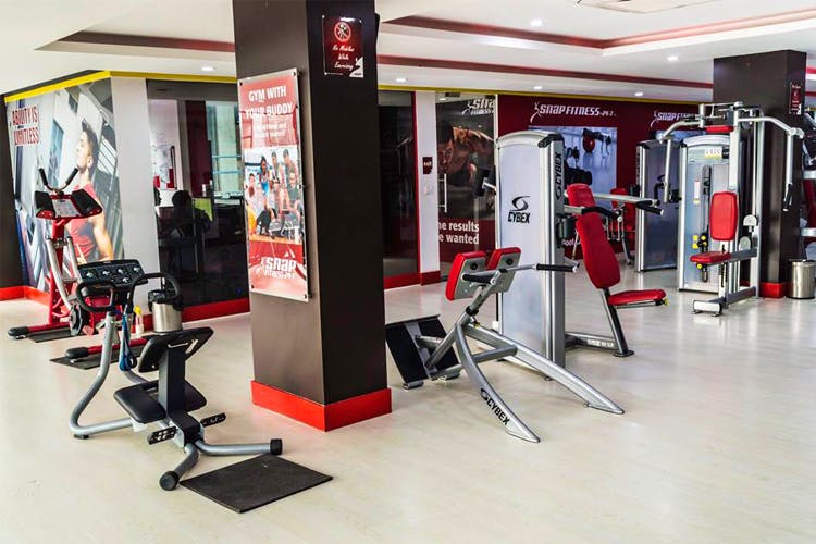 Gym,Sport venue,Room,Physical fitness,Exercise equipment,Weightlifting machine,Building,Interior design,Bench,Flooring