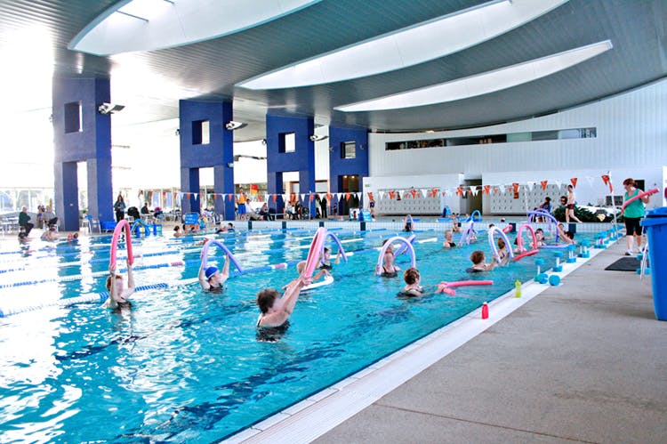 Swimming pool,Leisure centre,Leisure,Swimmer,Recreation,Sports,Swimming,Physical fitness,Sport venue,Exercise