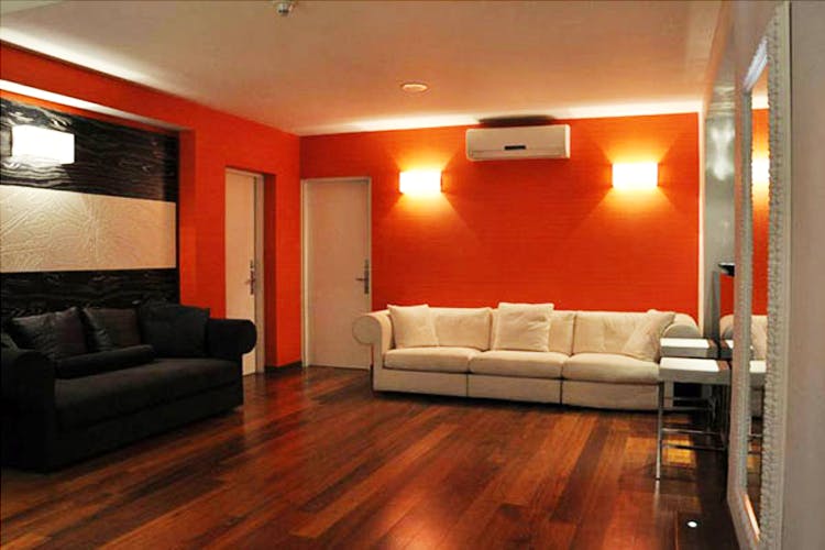 Room,Furniture,Interior design,Property,Building,Floor,Living room,Orange,Lighting,Ceiling