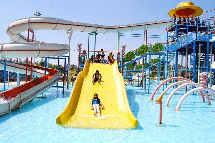Playground slide,Leisure,Water park,Fun,Outdoor play equipment,Chute,Playground,Amusement park,Recreation,Vacation